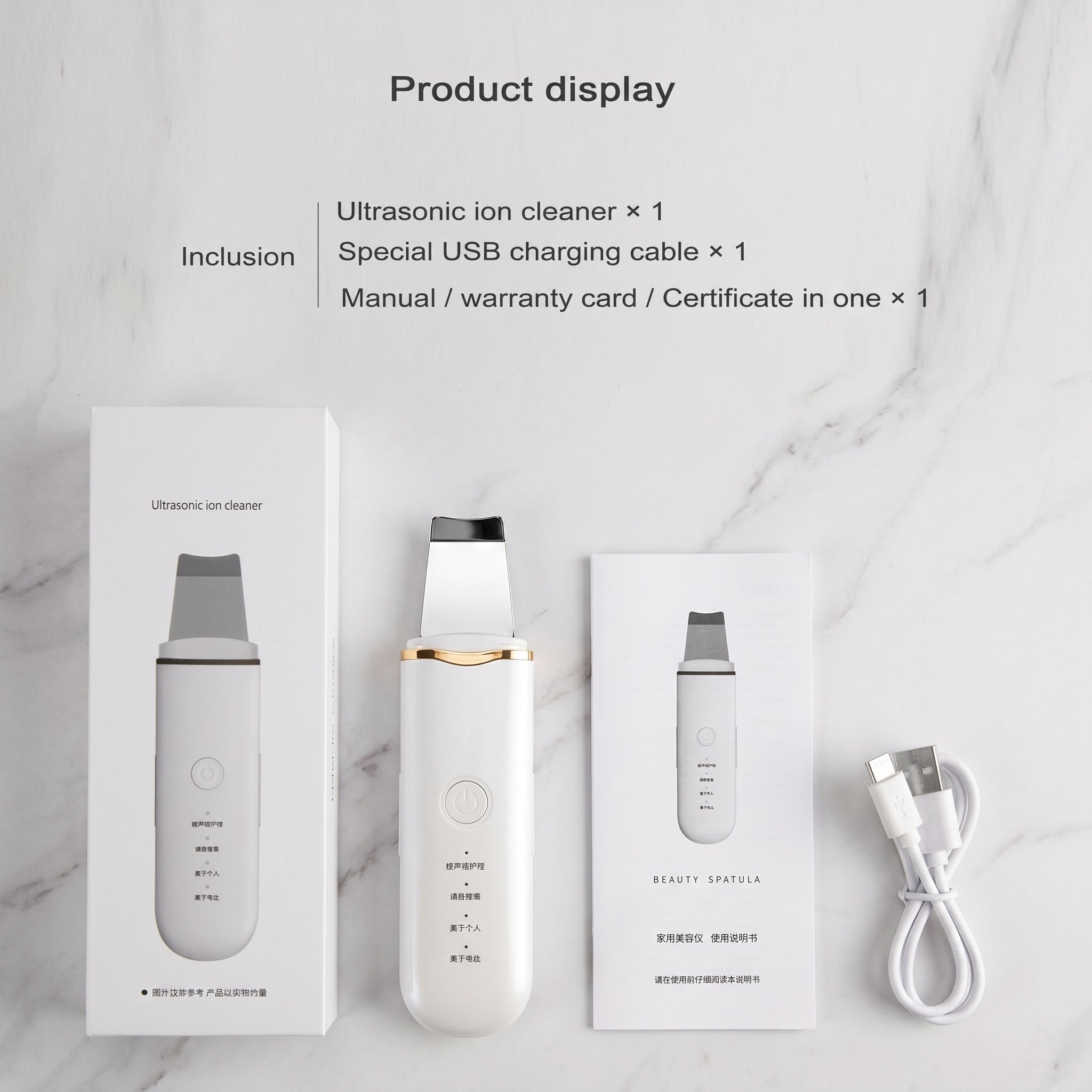 Packaging, USB cable, and manual on a marble surface