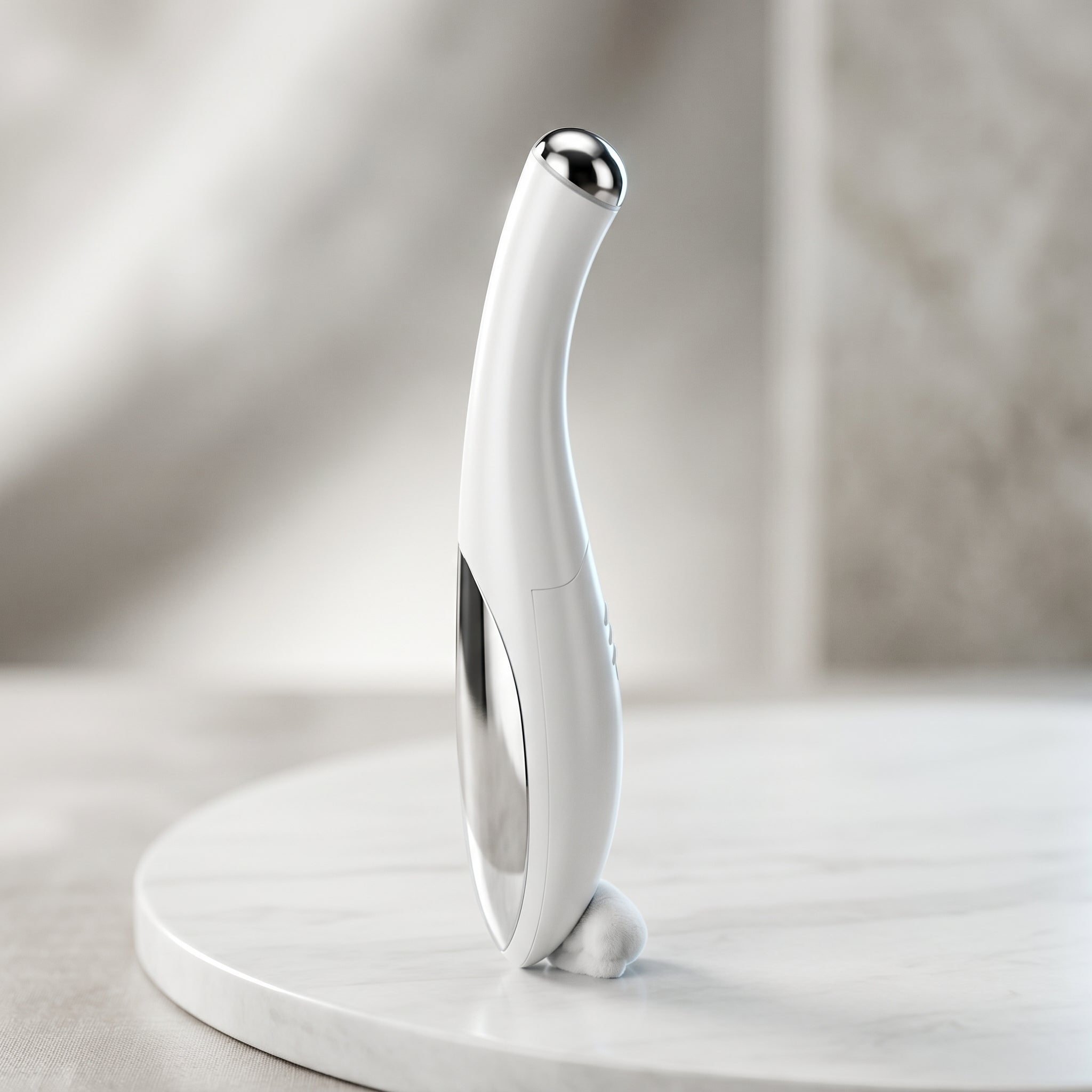 White mini eye device targeting fine lines and tired eyes.